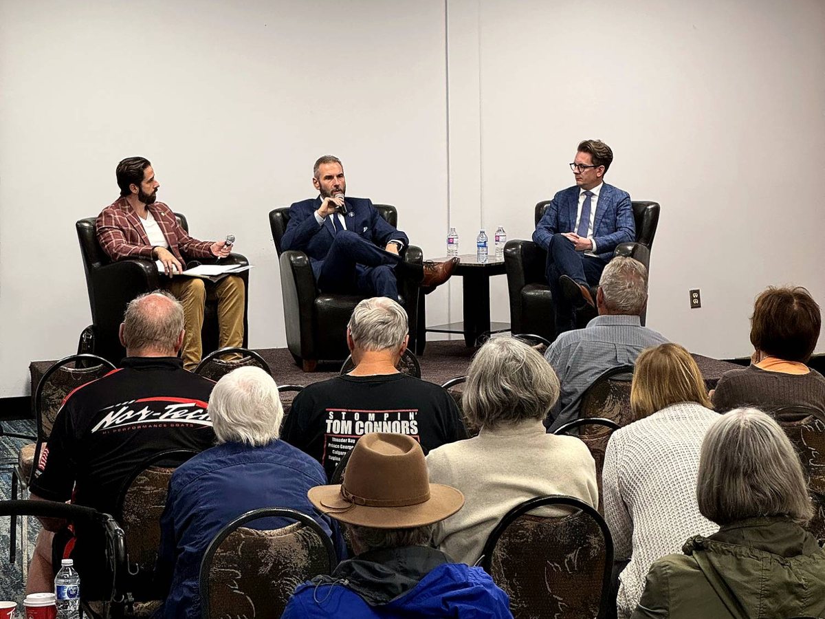 Cole Kander moderating a fireside chat with Minister Nate Glubish and Stacy Miskew